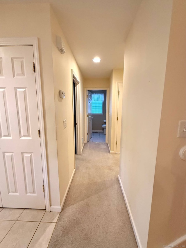 4 Amberly Ln Unit 4, East Lyme, CT 06357 - hallway with baseboards, light colored carpet, and light tile patterned floors