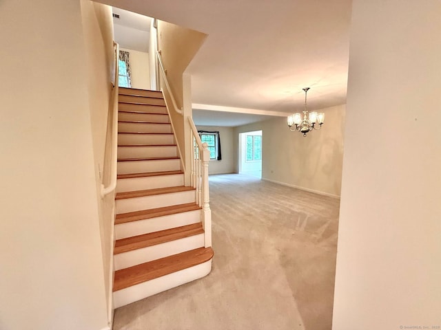 4 Amberly Ln Unit 4, East Lyme, CT 06357 - staircase featuring carpet flooring, a chandelier, and baseboards