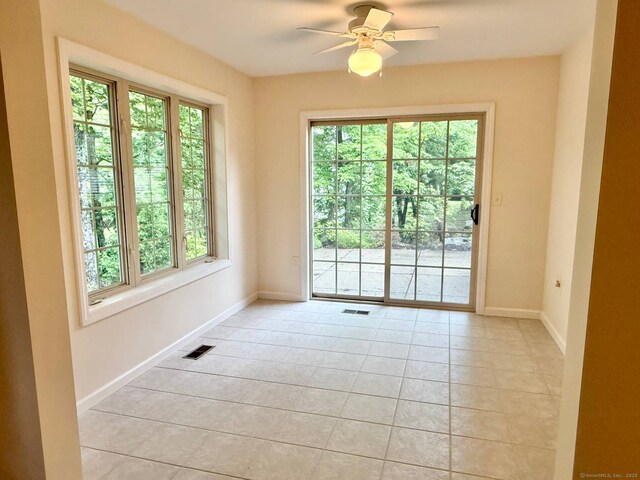 4 Amberly Ln Unit 4, East Lyme, CT 06357 - unfurnished room featuring light tile patterned floors, baseboards, and a ceiling fan