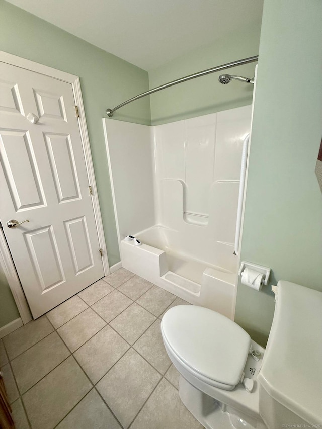 4 Amberly Ln Unit 4, East Lyme, CT 06357 - bathroom featuring tile patterned floors, toilet, baseboards, and washtub / shower combination