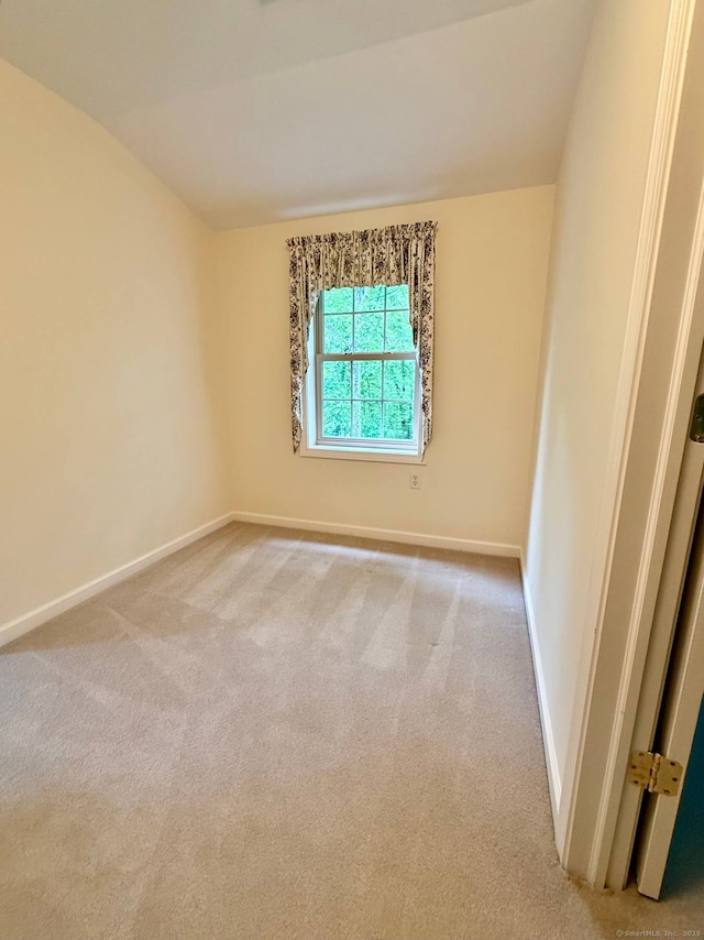4 Amberly Ln Unit 4, East Lyme, CT 06357 - unfurnished room featuring light carpet, baseboards, and lofted ceiling