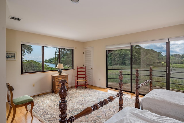 48 Andrews Rd, Guilford, CT 06437 - bedroom featuring multiple windows, wood finished floors, and baseboards