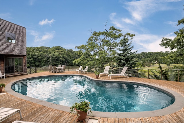 48 Andrews Rd, Guilford, CT 06437 - view of swimming pool with a deck, outdoor dining area, and fence