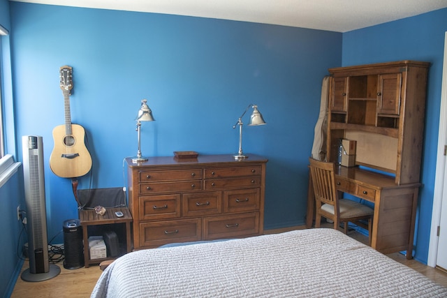 bedroom featuring light wood-type flooring