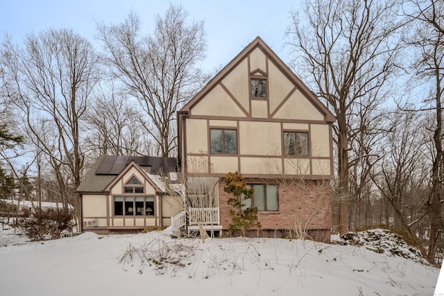 view of front of house featuring solar panels