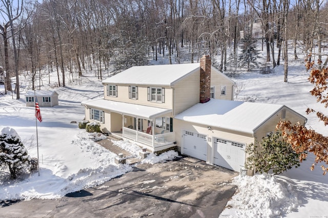 front of property with a garage and a porch