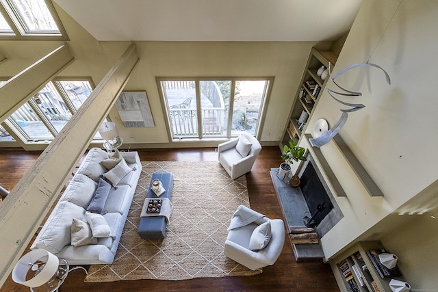 living room with plenty of natural light and wood finished floors