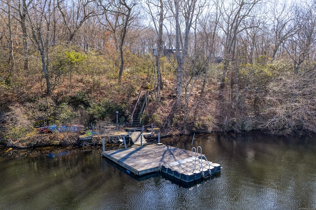 dock area with a water view and stairway
