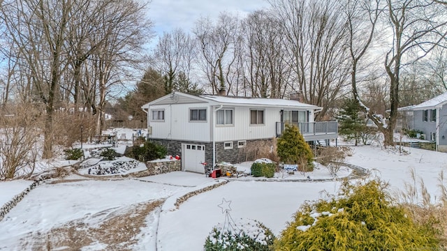 view of front of house with a garage and a balcony