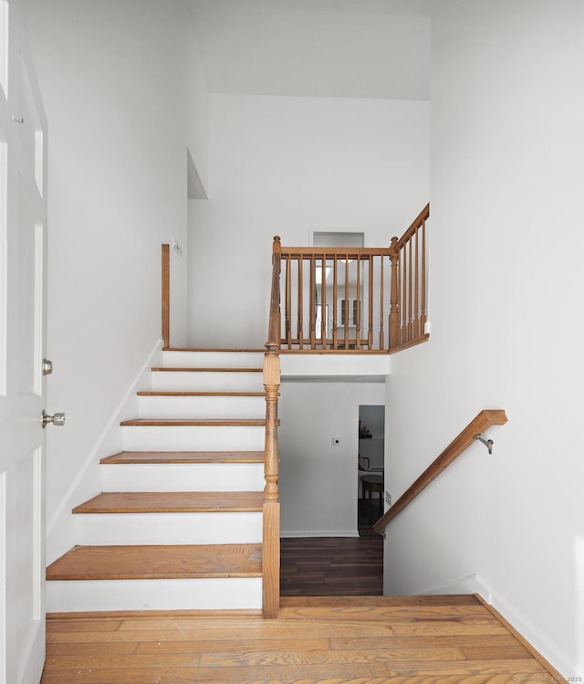 staircase featuring hardwood / wood-style floors