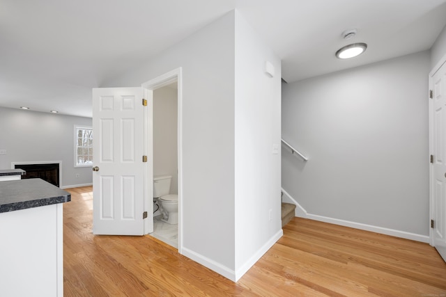 hallway with wood-type flooring