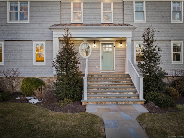 entrance to property with a standing seam roof and metal roof