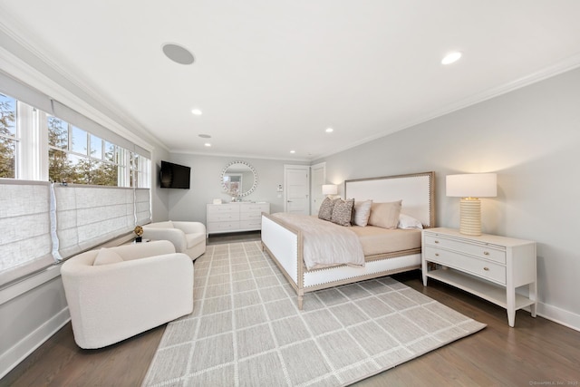 bedroom with recessed lighting, baseboards, crown molding, and wood finished floors