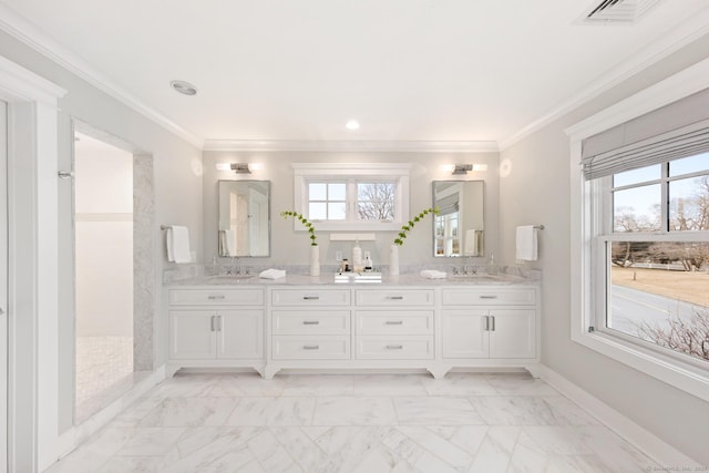 bathroom with crown molding, plenty of natural light, visible vents, and a sink