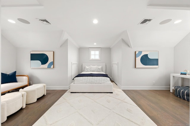 bedroom featuring visible vents, dark wood finished floors, and baseboards