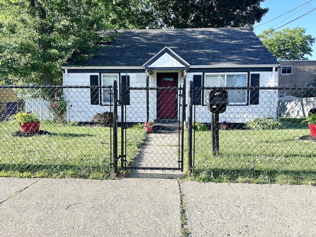 bungalow-style home featuring a front lawn