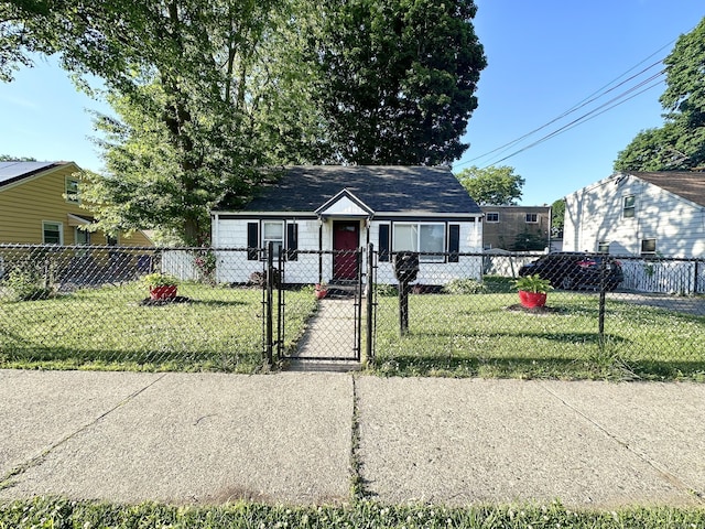 bungalow-style house featuring a front lawn