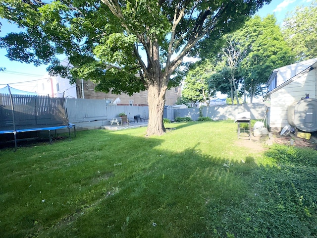 view of yard with a trampoline