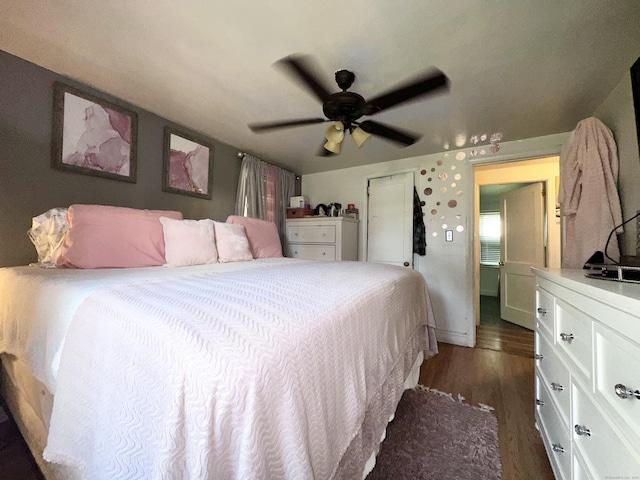 bedroom featuring dark wood-type flooring and ceiling fan