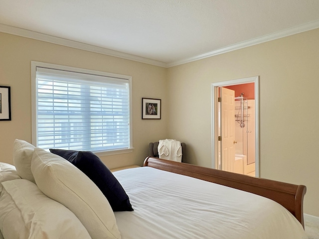 bedroom featuring crown molding and connected bathroom