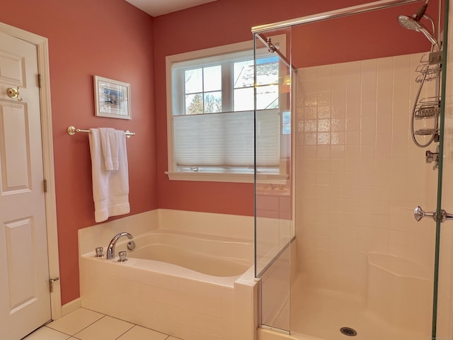 bathroom featuring tile patterned floors and independent shower and bath