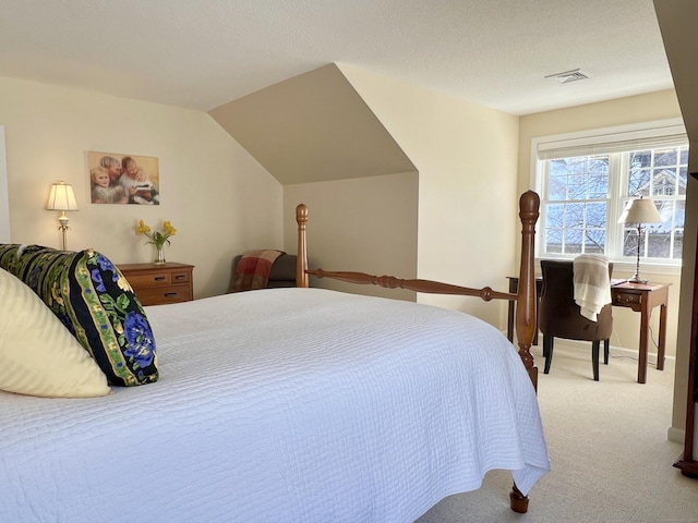 bedroom with light carpet and vaulted ceiling