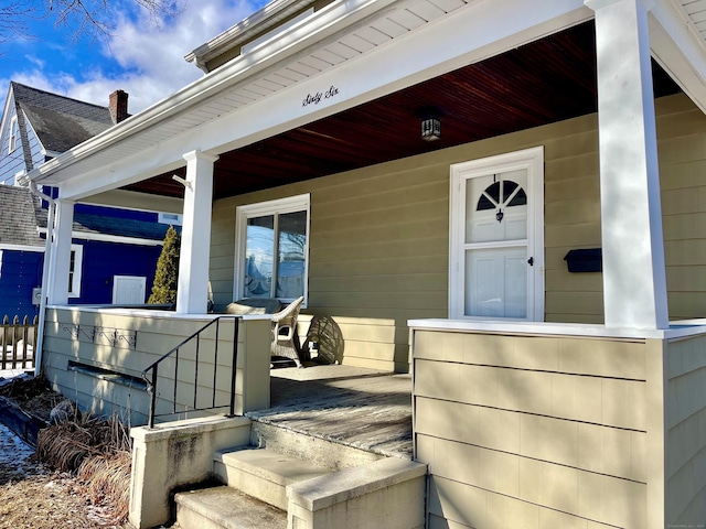 doorway to property featuring covered porch