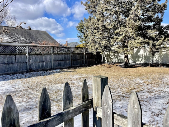 view of yard covered in snow