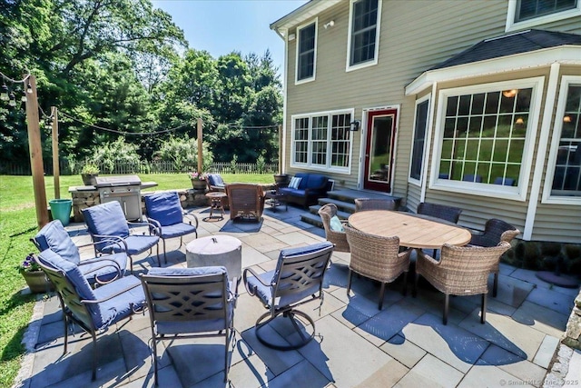 view of patio featuring an outdoor living space and grilling area