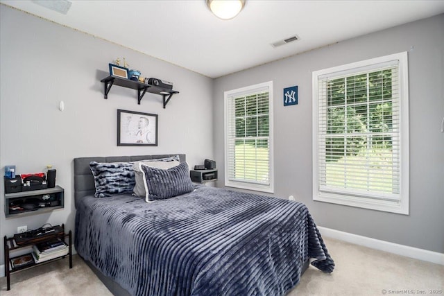 bedroom with light colored carpet