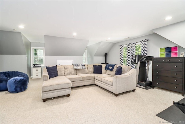 living room with lofted ceiling and carpet