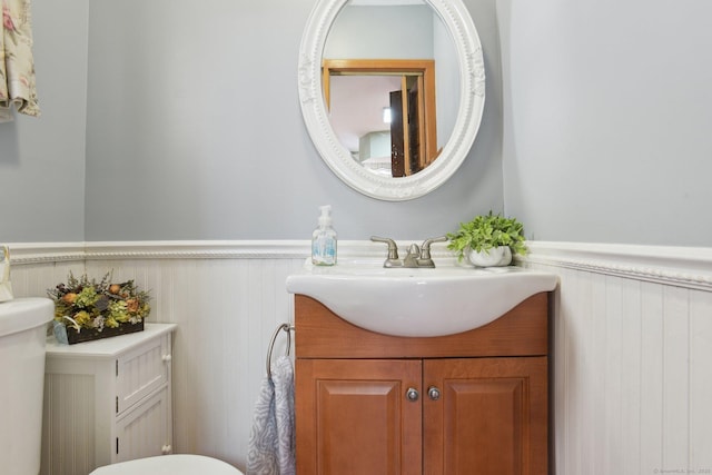 bathroom with wainscoting and vanity