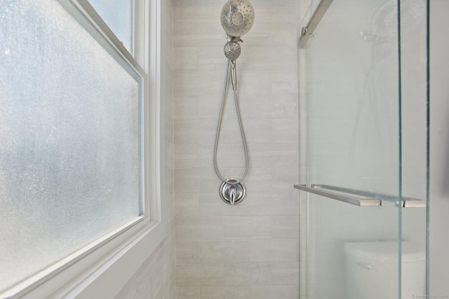 full bath featuring a tile shower