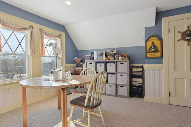 dining area with light colored carpet, wainscoting, vaulted ceiling, and recessed lighting