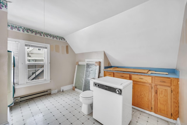 bathroom featuring a baseboard heating unit, vaulted ceiling, and toilet