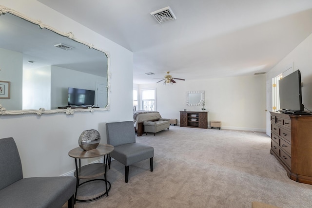 living area with carpet, visible vents, and baseboards