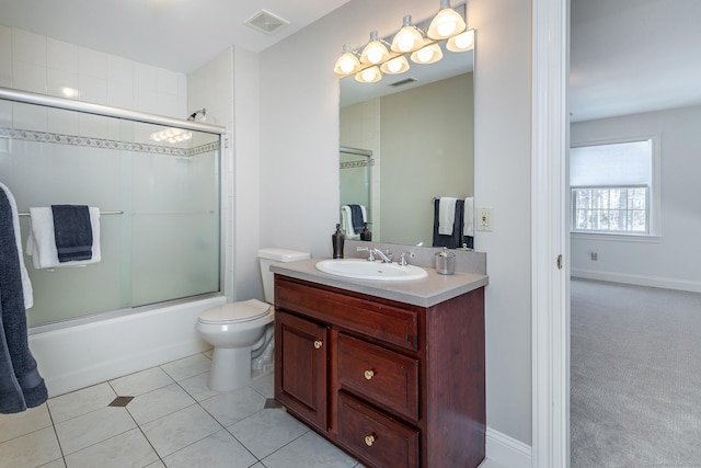 bathroom with tile patterned flooring, visible vents, vanity, and toilet