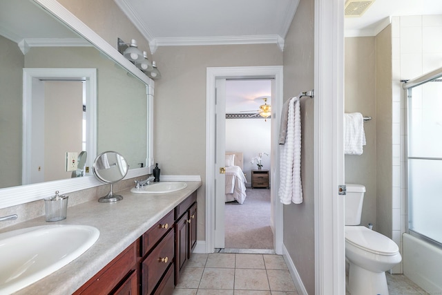 ensuite bathroom with connected bathroom, ornamental molding, and a sink