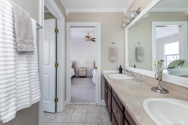 ensuite bathroom featuring double vanity, ornamental molding, a sink, and ensuite bathroom