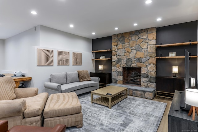 living area featuring a fireplace, wood finished floors, and recessed lighting