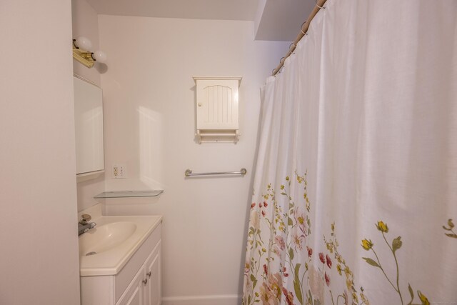 bathroom with vanity and a shower with shower curtain