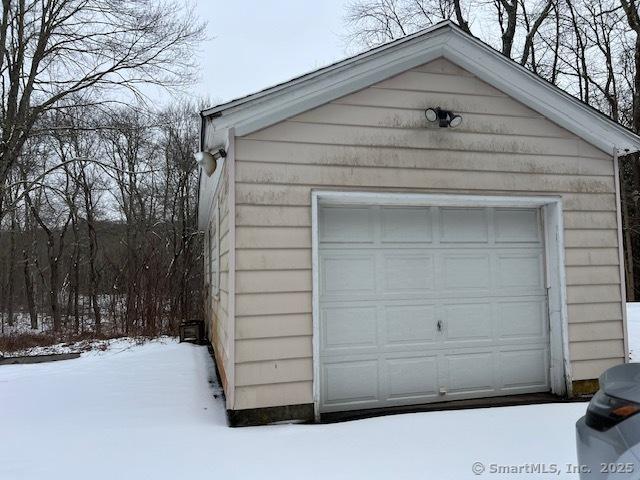 view of snow covered garage