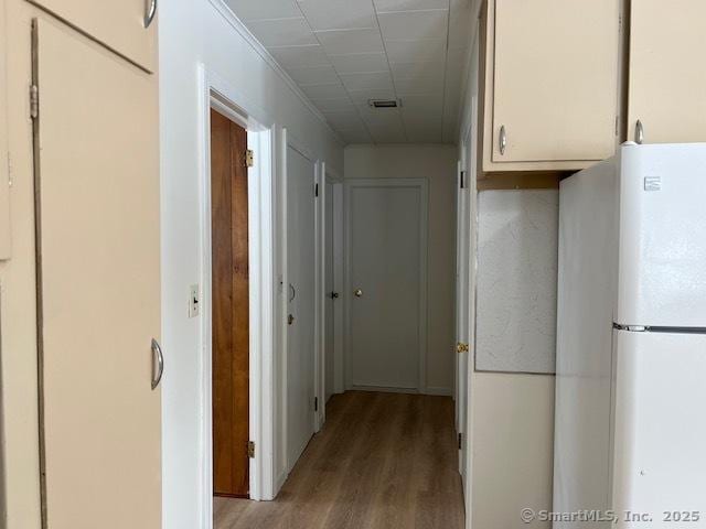 hall with light hardwood / wood-style floors