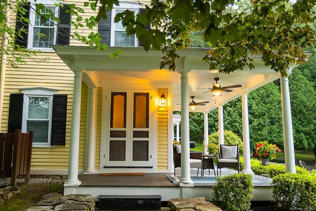 doorway to property with ceiling fan and covered porch