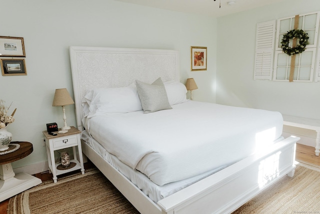 bedroom with hardwood / wood-style floors