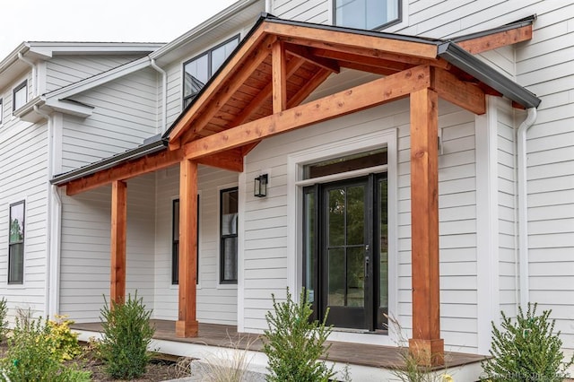 doorway to property with a porch