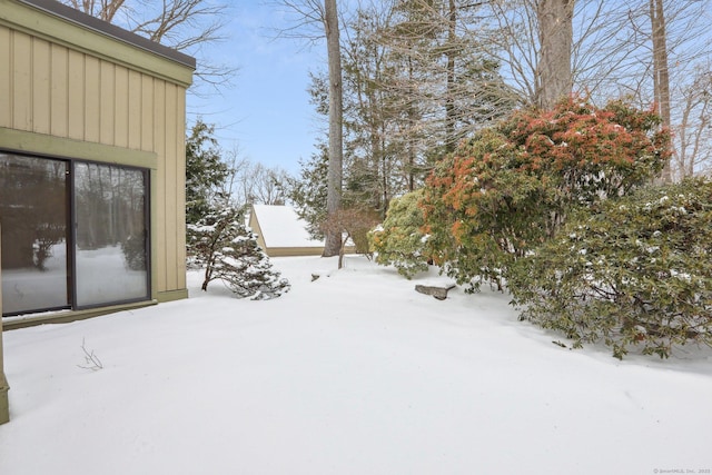 view of yard covered in snow