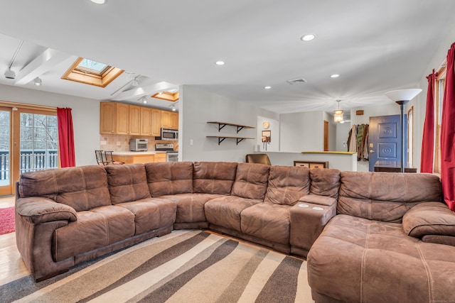 living room with a skylight