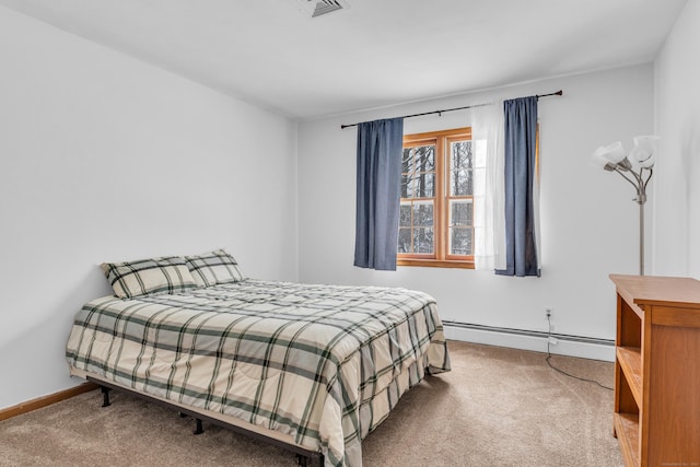 carpeted bedroom featuring baseboard heating