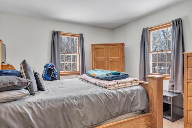 bedroom with multiple windows